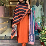 Orange Color Kurti Suit Set Seems To Be A Party Wear Outfit Rayon fabric with Maslin Dupatta.